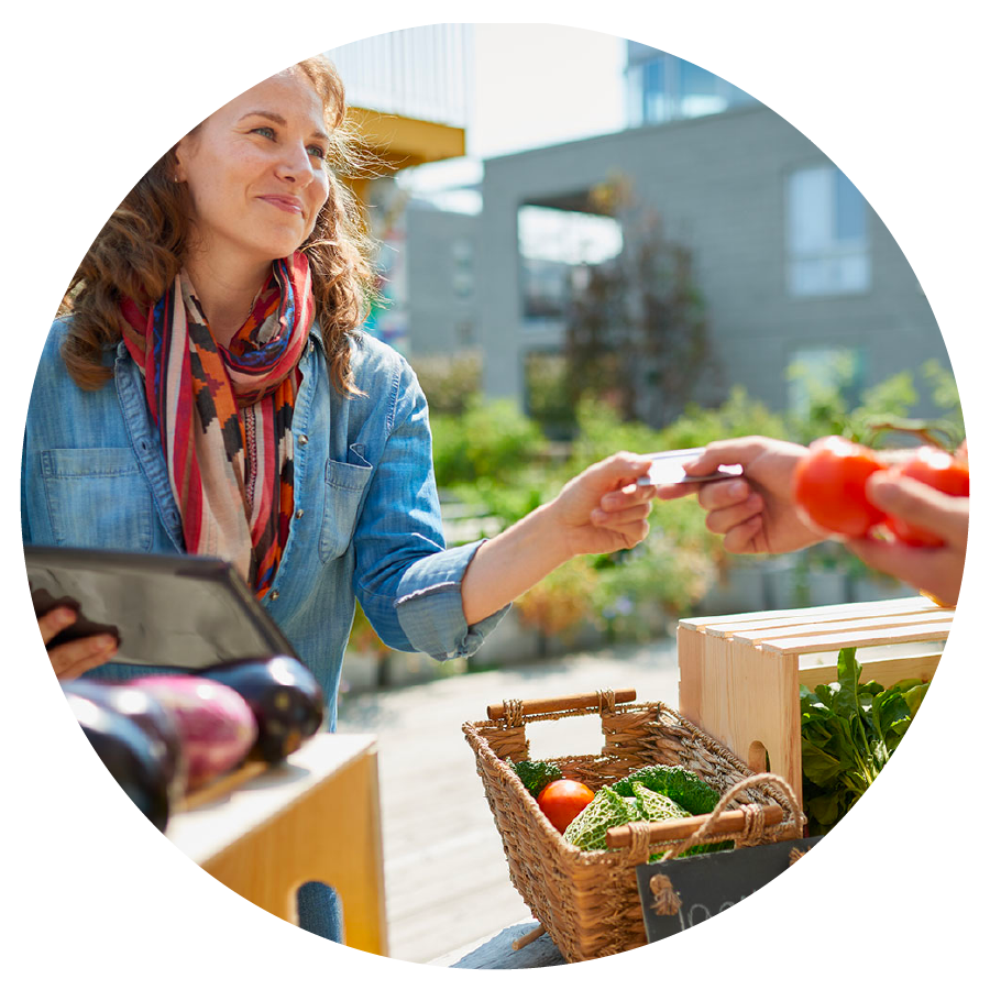 Woman paying at farmers market