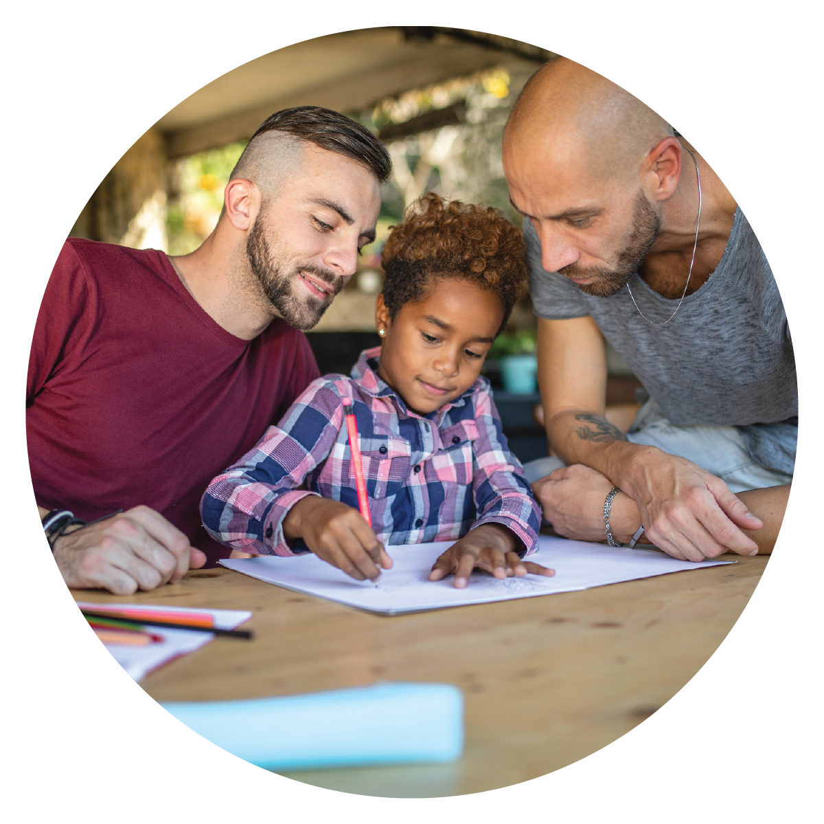 LGBTQ+ family helping child with homework