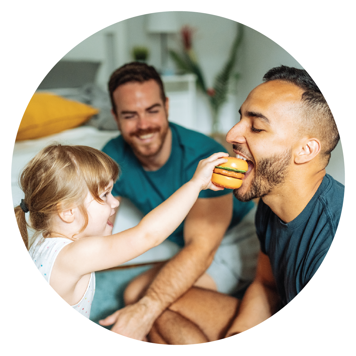 LGBTQ+ family playing with child