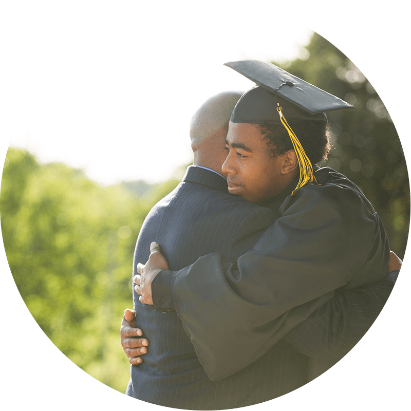 Graduate hugging father